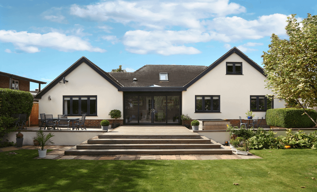 A cream house with brown windows